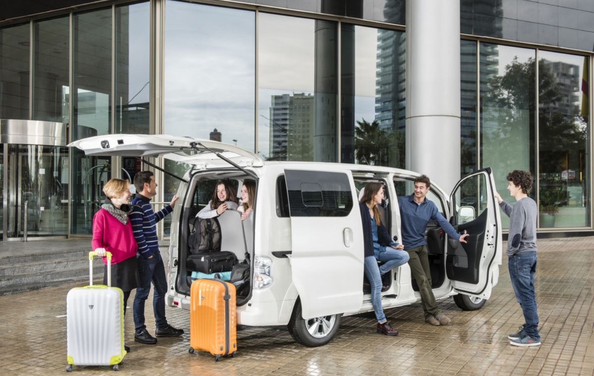 Family group loading into an Alphard or Hiace for Zanzibar airport transfer