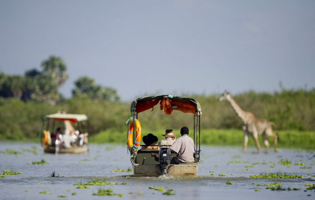 Traditional safari boat drifting on the Rufiji River in Nyerere National Park